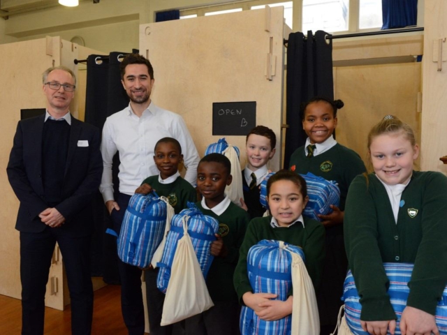 Damien Egan, Tim Fallon and Rathfern School children, who donated 80 sleeping bags and toiletry packs for homeless people.